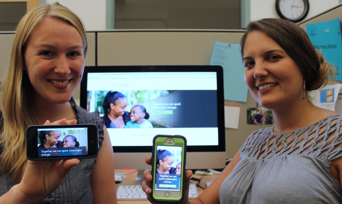 Denise Miller (left) and Erin Murphy show off the mobile-friendliness of the new Firesteel website. Image by Stephanie Heffner.